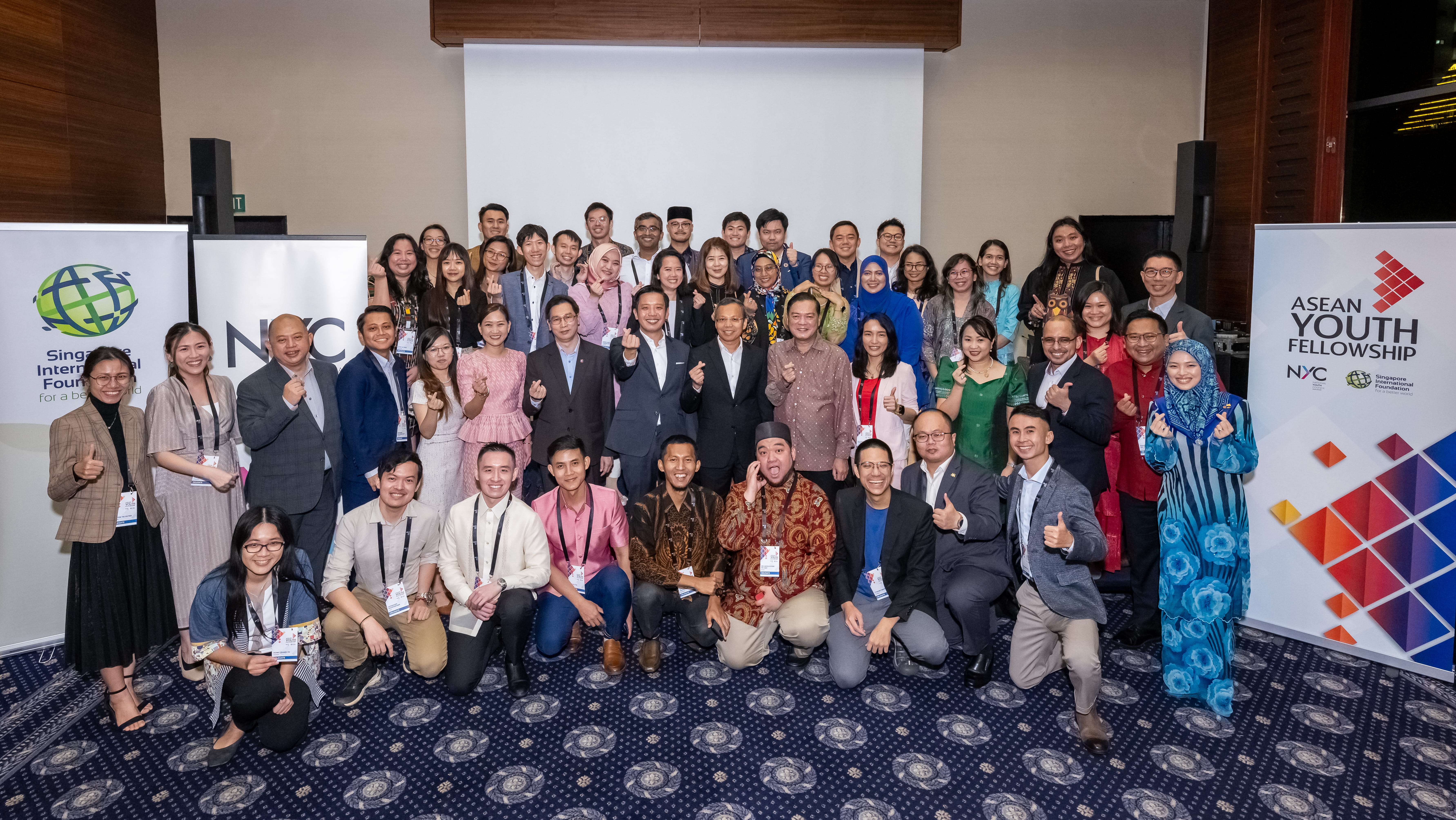 Group photo of ASEAN Youth Fellows with VIP guests at the welcome dinner in Singapore